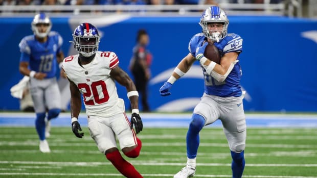 Detroit Lions wide receiver Chase Cota (88) runs after a catch against New York Giants cornerback Amani Oruwariye (20) during the second half of a preseason game at Ford Field in Detroit on Friday, Aug. 11, 2023.